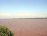 Children playing on the riverside